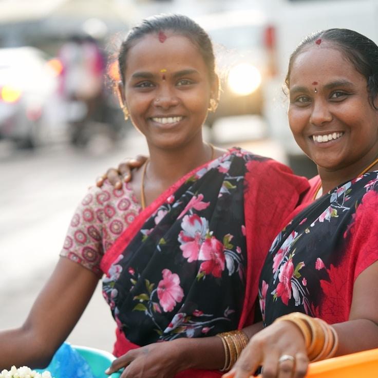 Aanya Singh, Lead Design Curator at Sprig Stone Press, reviewing corporate floral arrangements